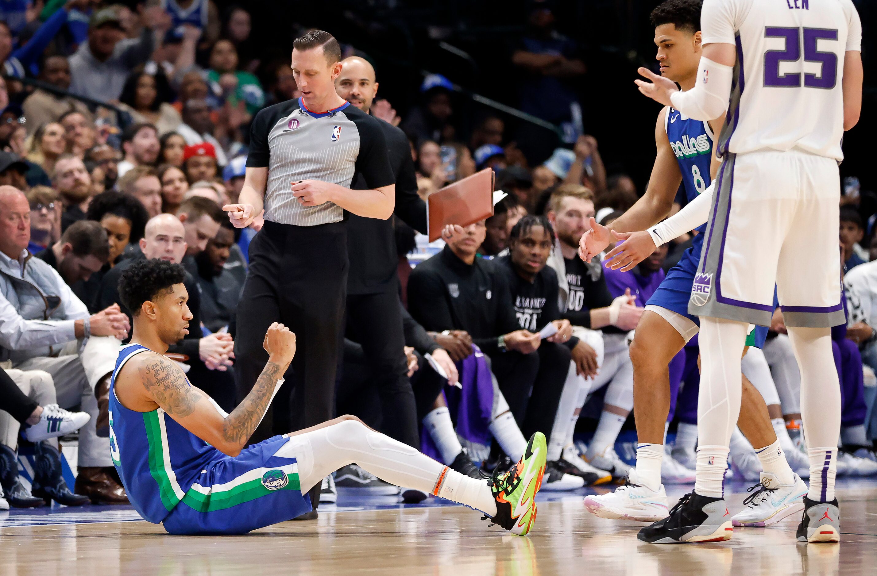 Dallas Mavericks forward Christian Wood (35) reacts after hitting a second half...