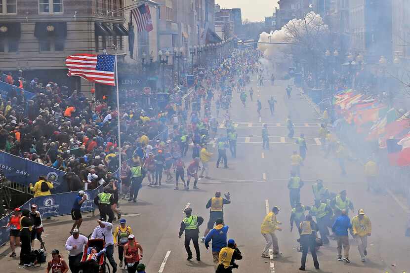 As runners and spectators reacted to the first explosion near the finish line of the Boston...