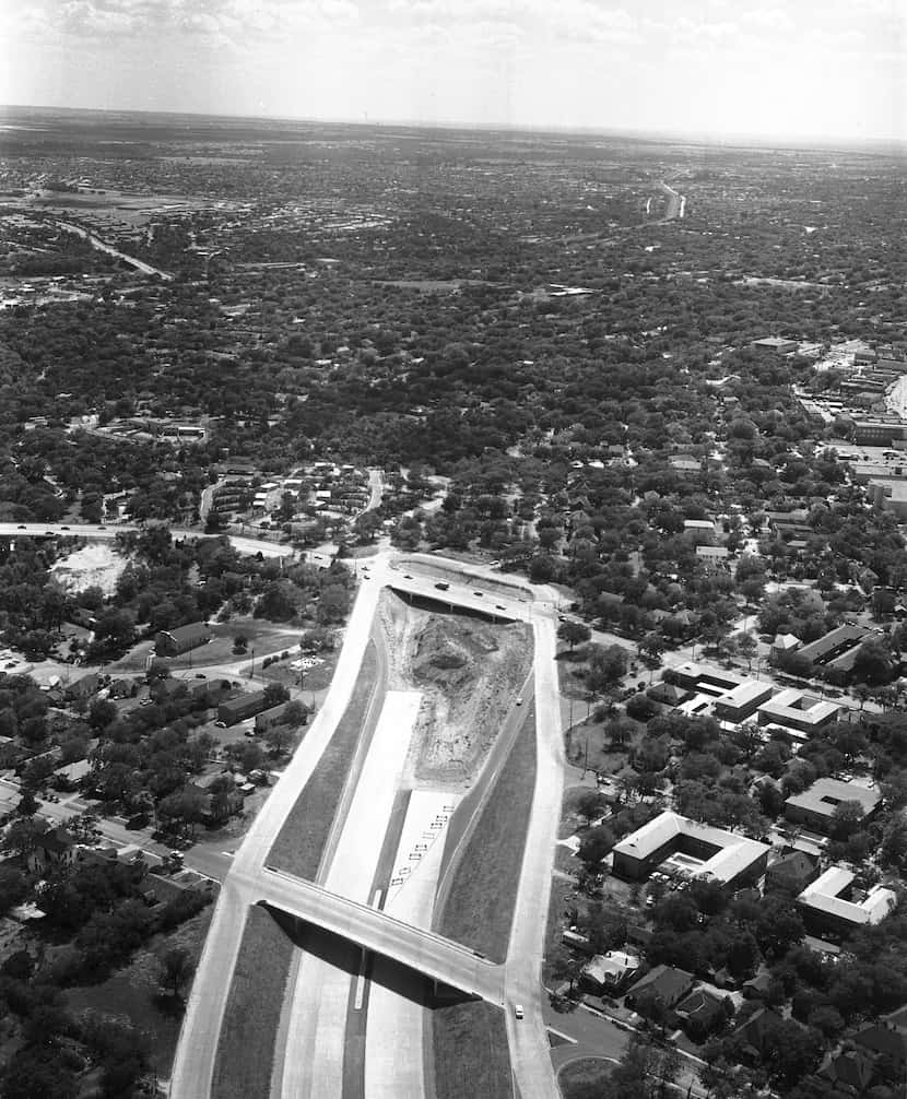 This 1959 photo shows how the construction of R.L Thornton Freeway, I-35E, cut directly...