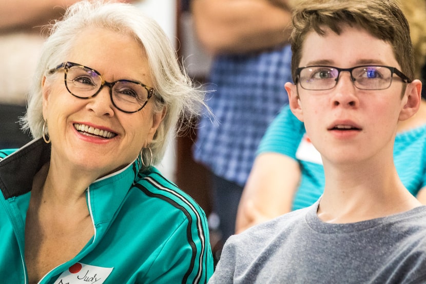 Judy Marcum and Garrett Mathiews, both of Dallas, listen to a presentation led by Peter...