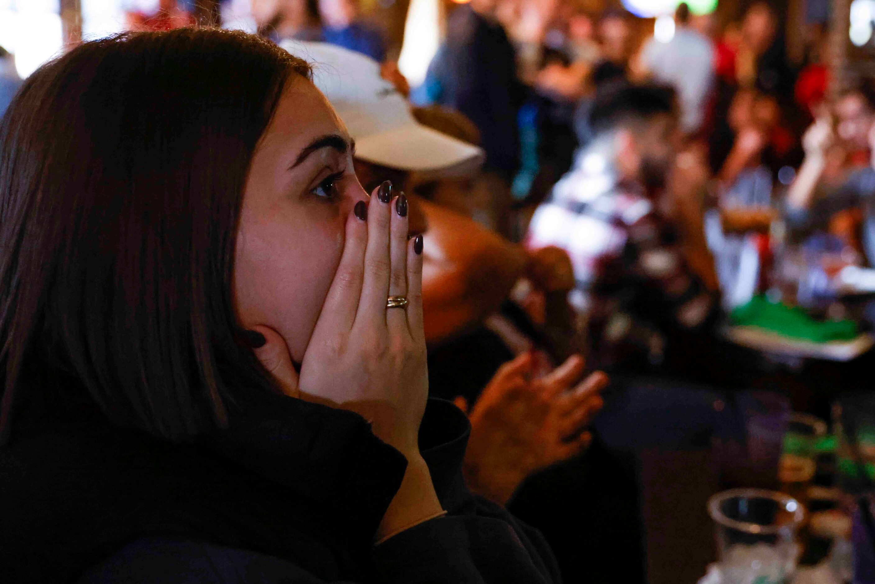 Jessi Hamer of Dallas, reacts during a tensed moment at a World Cup watch party between USA...