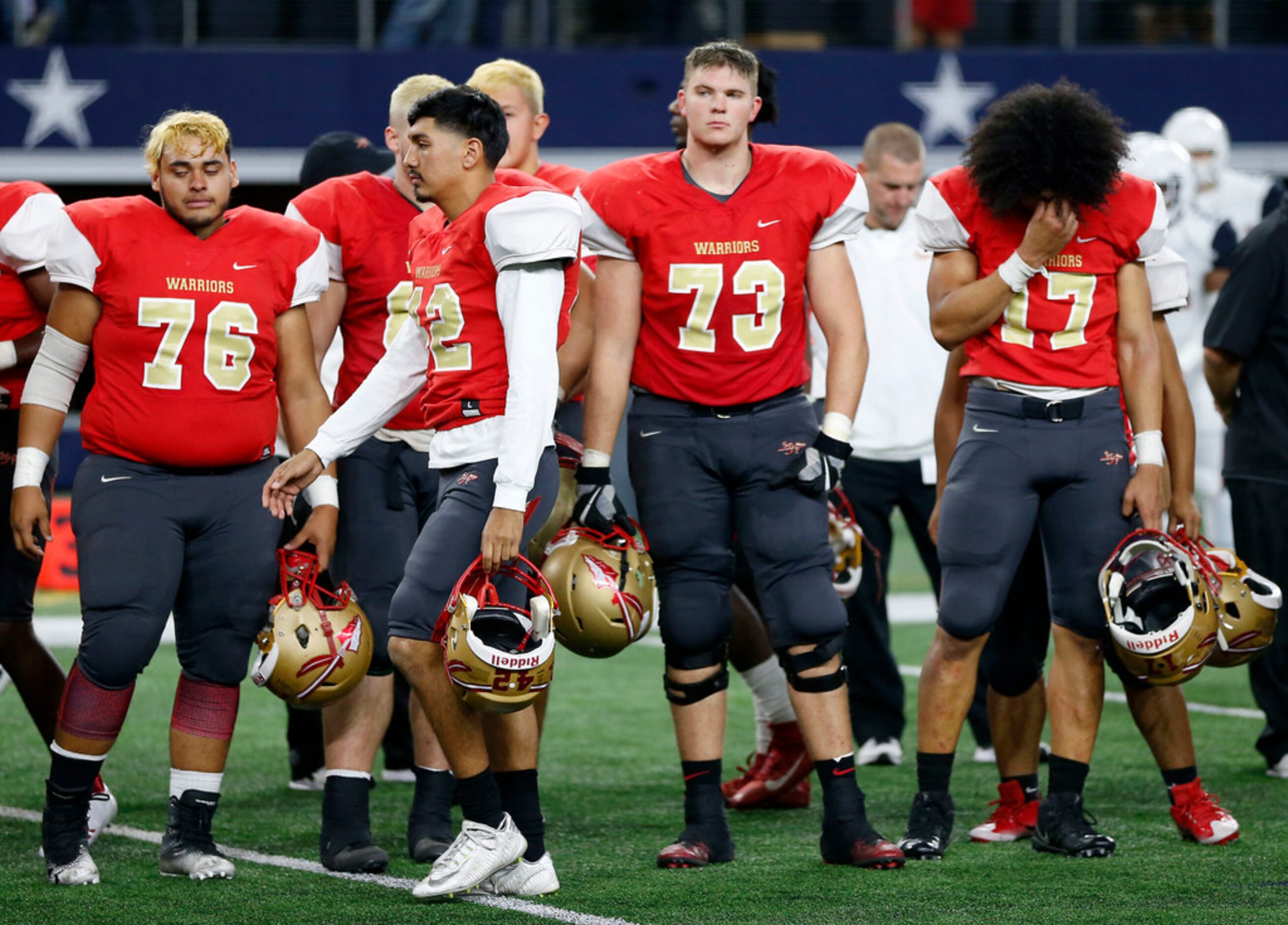 Dejected South Grand Prairie players Ismael Moreno (76), Luis Ornelas (42), Ryan Palmer (73)...