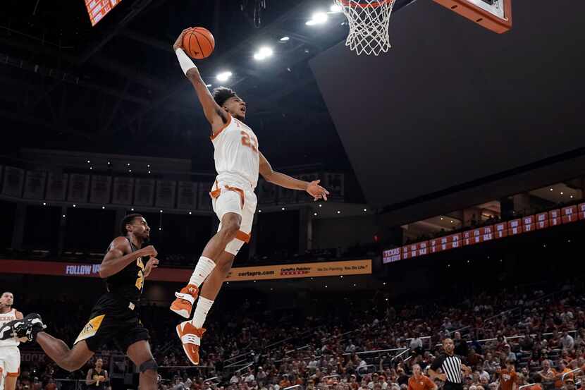 Texas forward Dillon Mitchell (23) drives to the basket against Arkansas-Pine Bluff during...