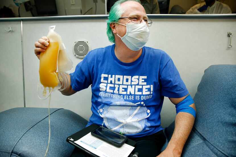 Matt Burnside (left), of Dallas, is proud of his 650ml plasma donation at a mobile Carter...