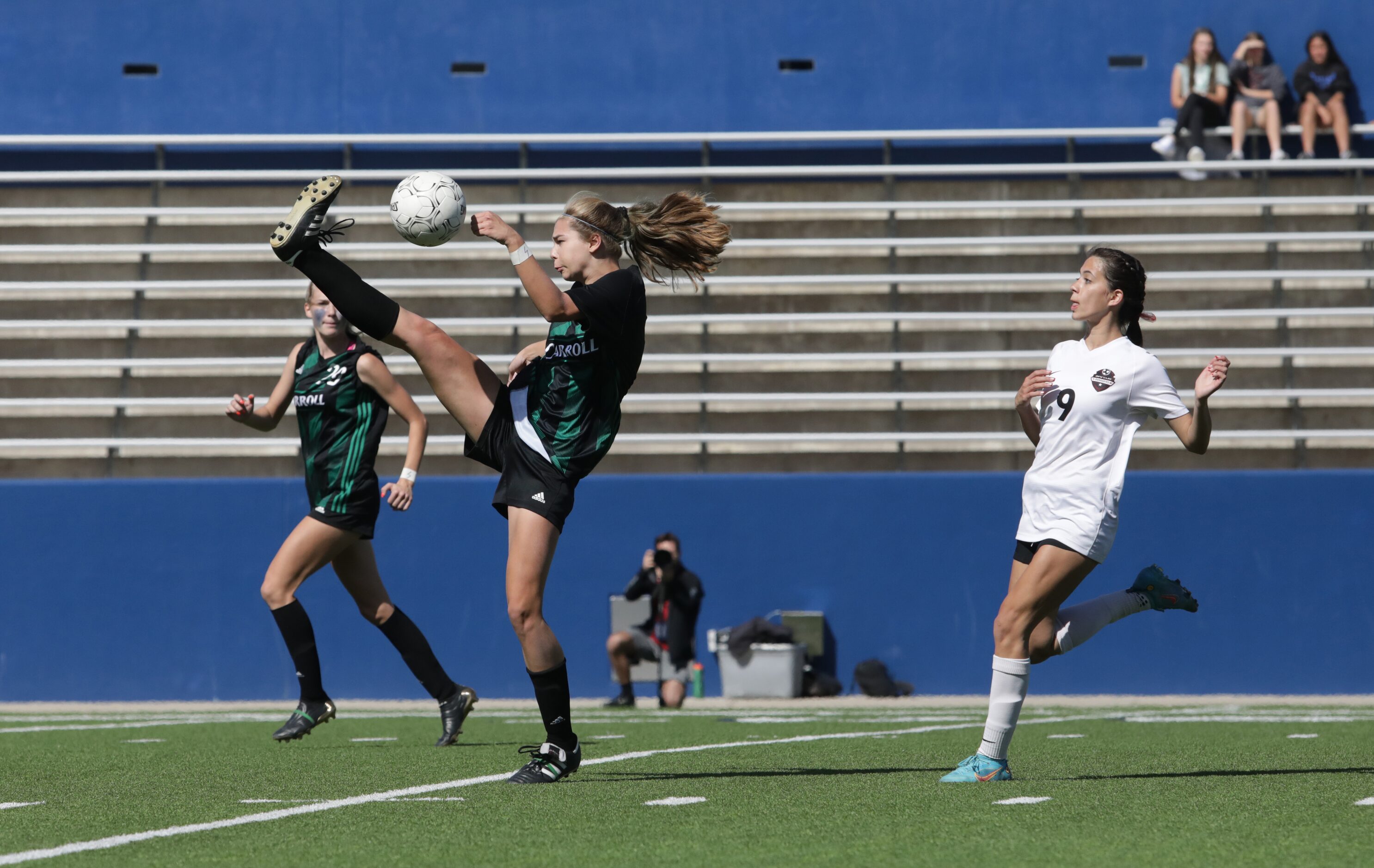 Southlake Carroll player #18, Parker Wilkerson, kicks the ball during a Class 6A Region I...