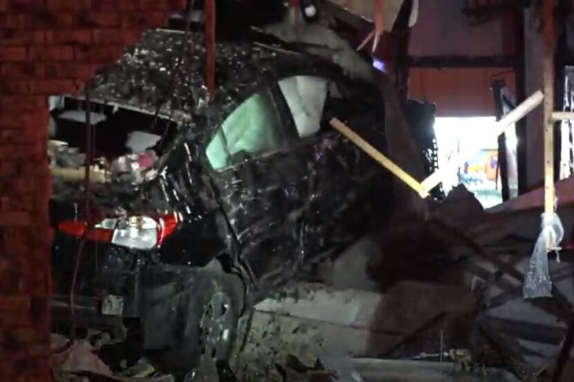 A car crashed into a Fort Worth pizza restaurant Monday night, injuring four people.
