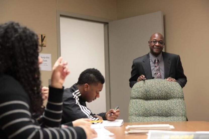 
Students in Pinkston’s law practicum listen as first assistant public defender Paul Blocker...