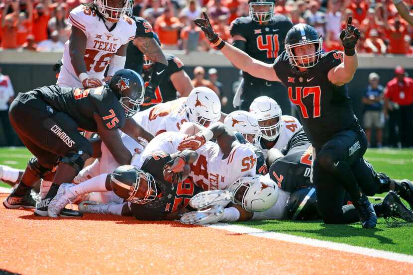 STILLWATER, OK - OCTOBER 1 :  Tight end Blake Jarwin #47 reacts to running back Barry J....