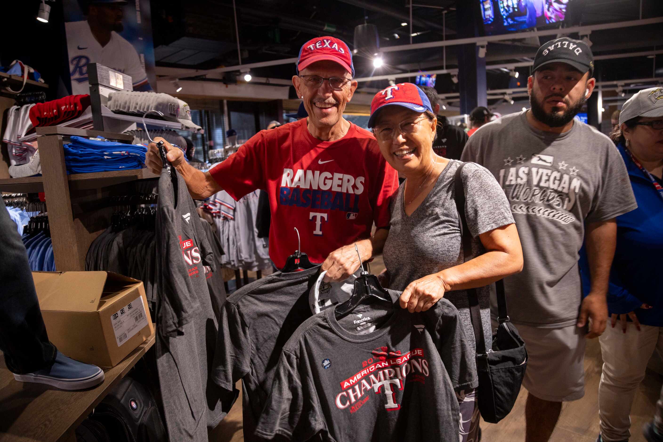 Rangers fans Randy Keadey (left) and wife Yong Hong pose for a photo with American League...