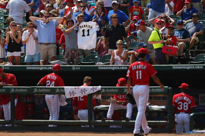 ARLINGTON, TX - SEPTEMBER 14:  Fans cheer after Yu Darvish #11 of the Texas Rangers makes...