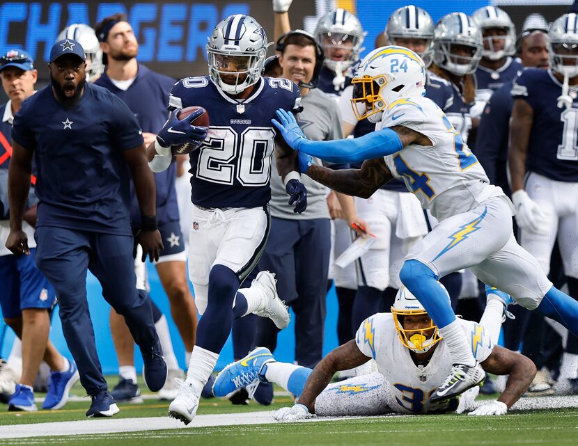 Dallas Cowboys running back Tony Pollard breaks away down the sideline before Los Angeles...