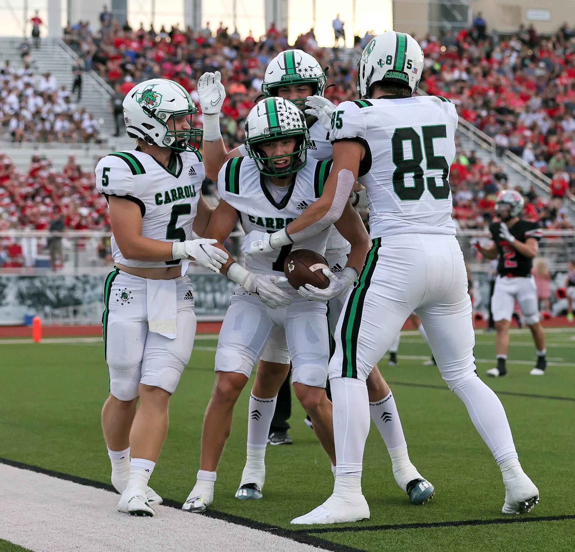 Southlake Carroll wide receiver Jacob Jordan (7) celebrates with tight end Jack VanDorselaer...