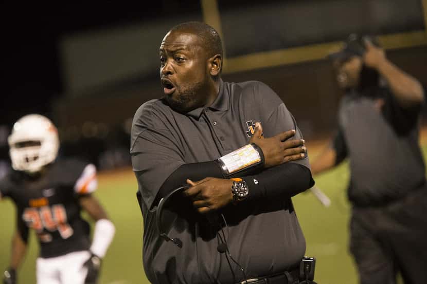 Tigers head coach Chris Gilbert calls for holding during Lancaster's matchup against...