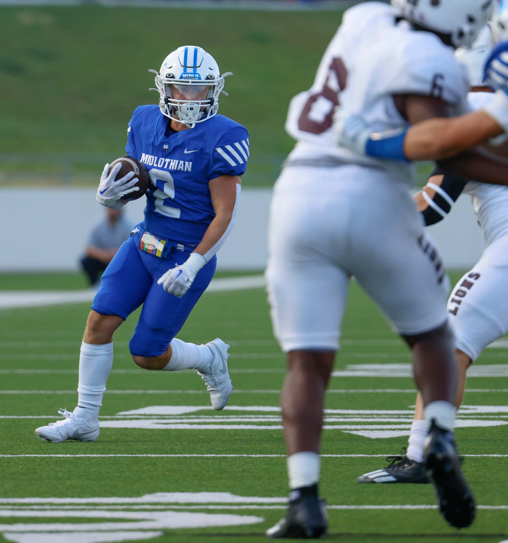 Midlothian high’s Slater Callahan (2) runs with the ball during a football game against...