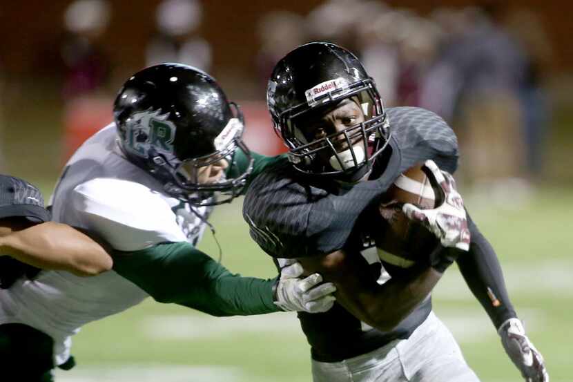 Timberview’s Travonne Armstead (22), breaks a tackle, as Mansfield Lake Ridge faces...