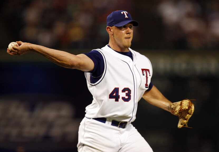 Texas starter Kameron Loe throws to first after fielding a grounder in the fifth inning on...