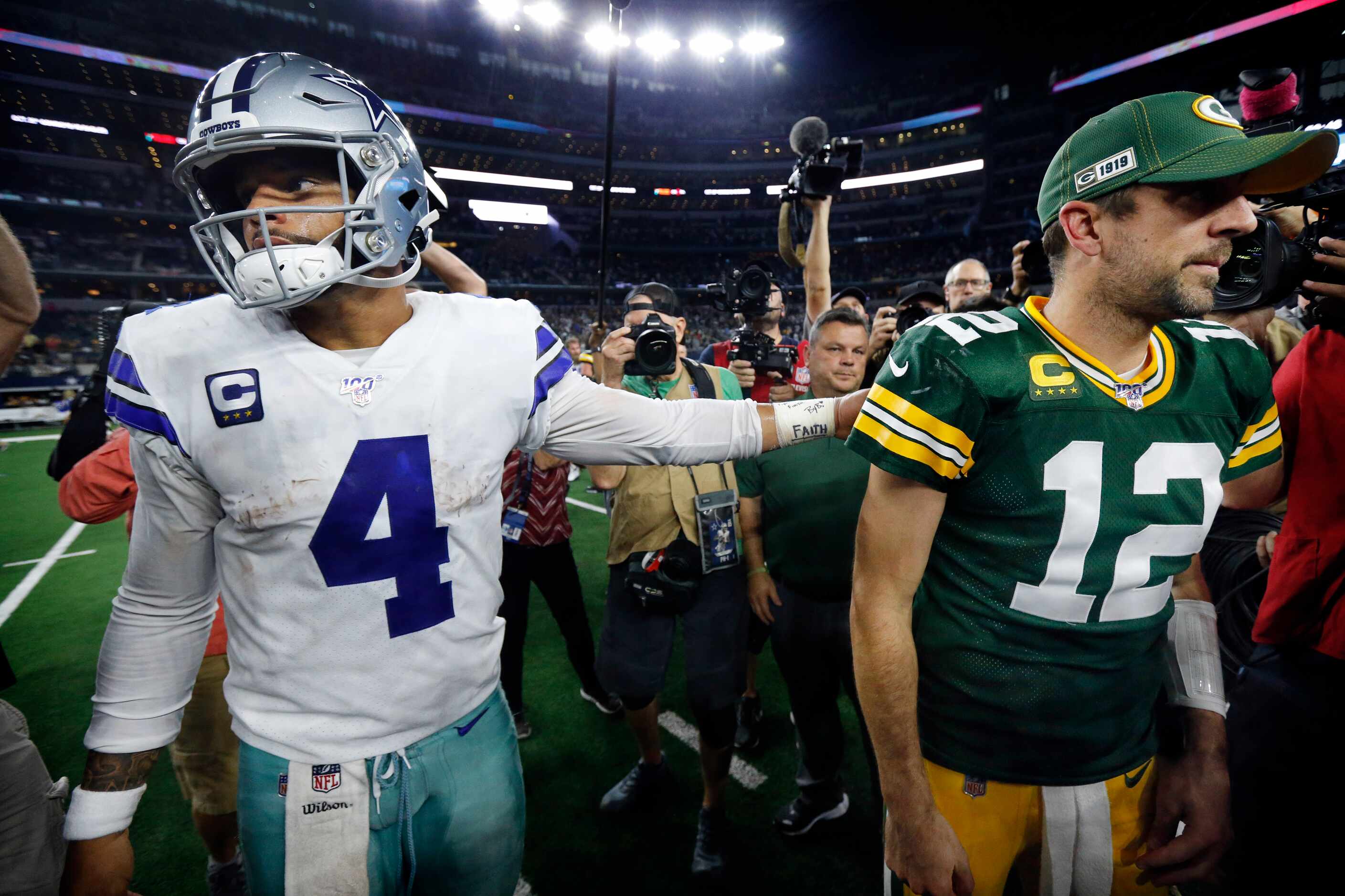 Dallas Cowboys quarterback Dak Prescott (4) congratulates Green Bay Packers quarterback...