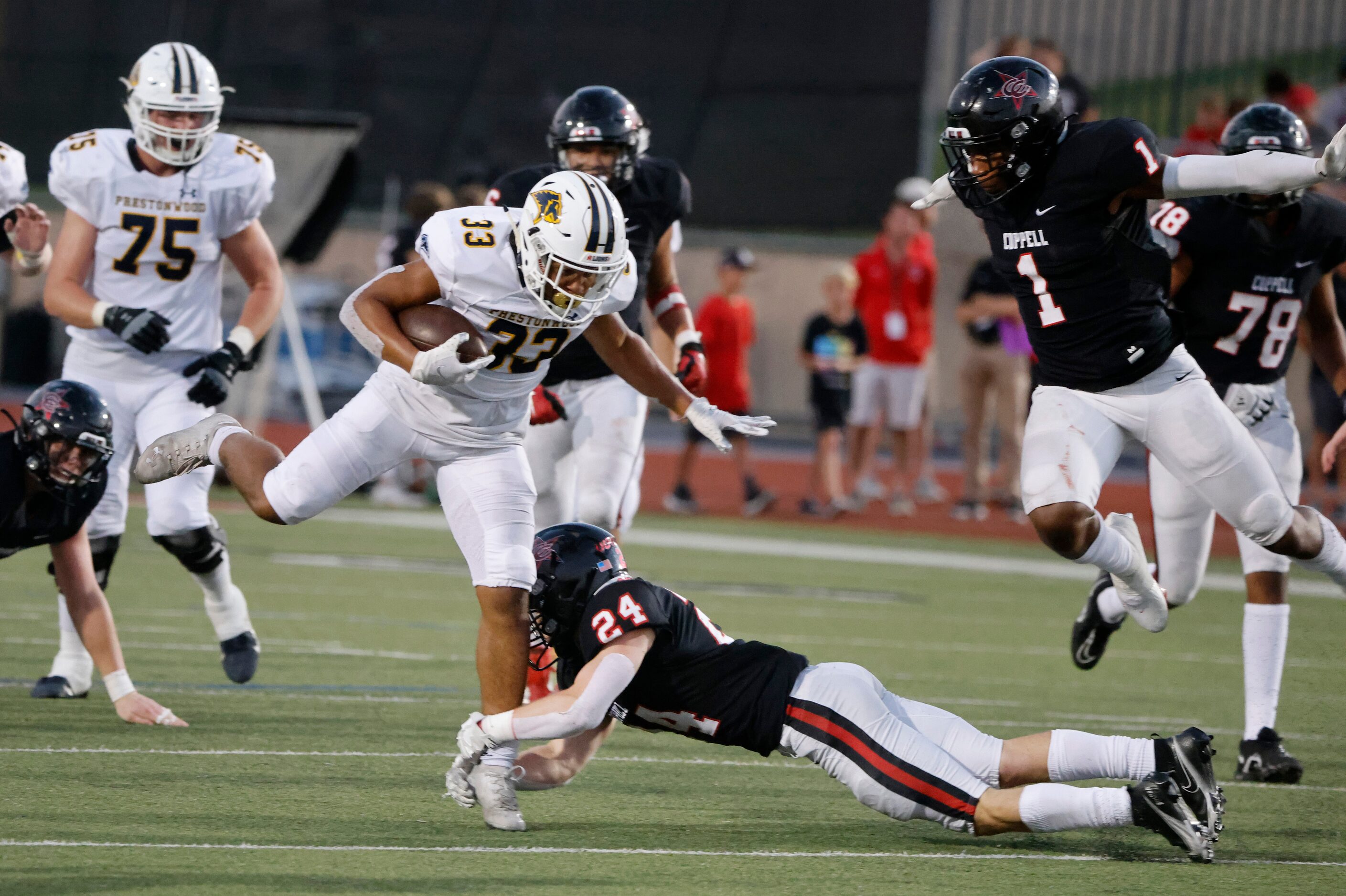 Prestonwood Christian Academy running back Jaden Lindsay (33) tries to get away from Coppell...