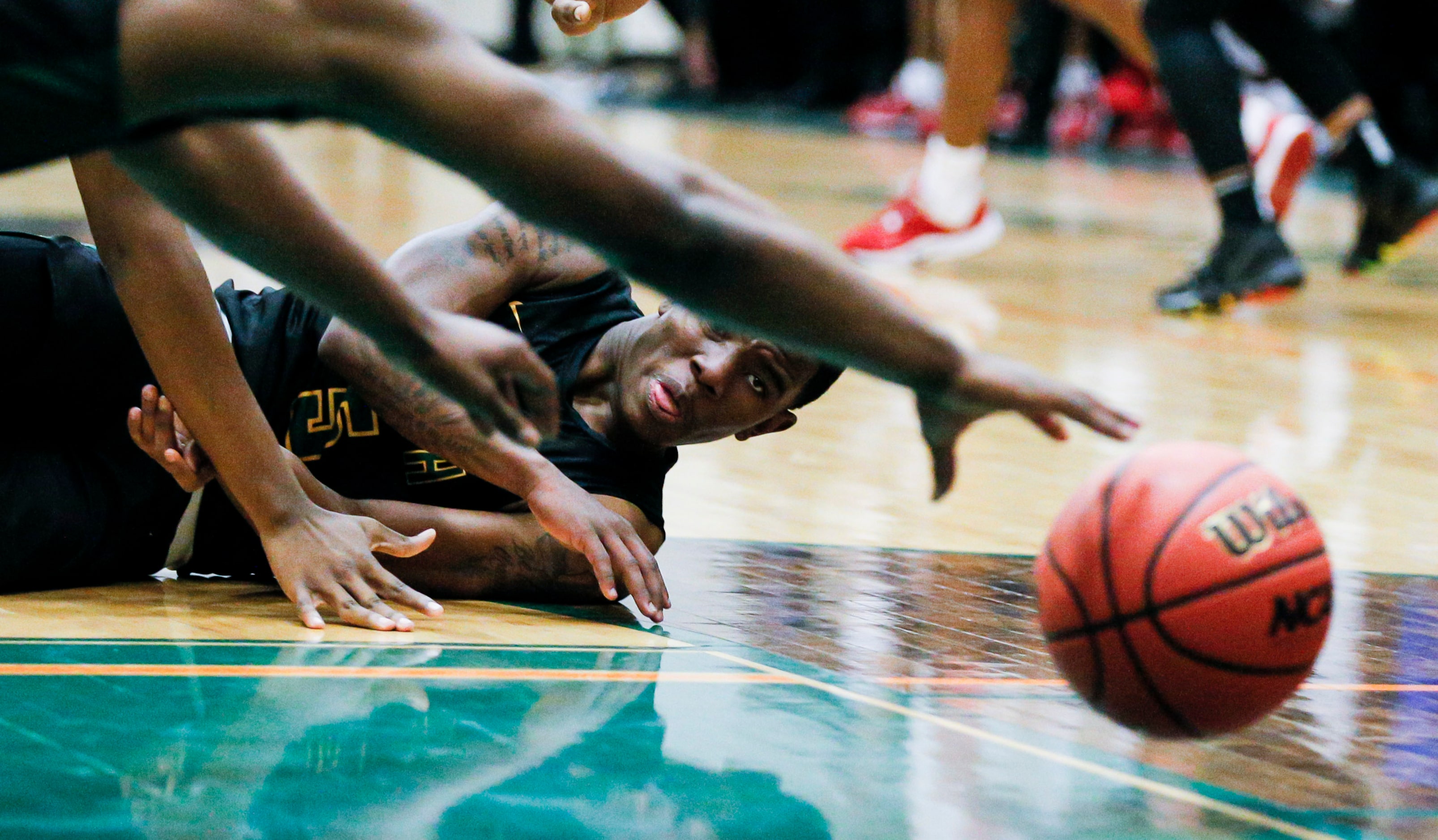 Newman Smith sophomore Devin Peters-Teague attempts to pass during the first half of a Class...