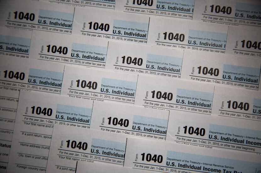 IRS 1040 Individual Income Tax forms for the 2015 tax year are seen in this arranged...