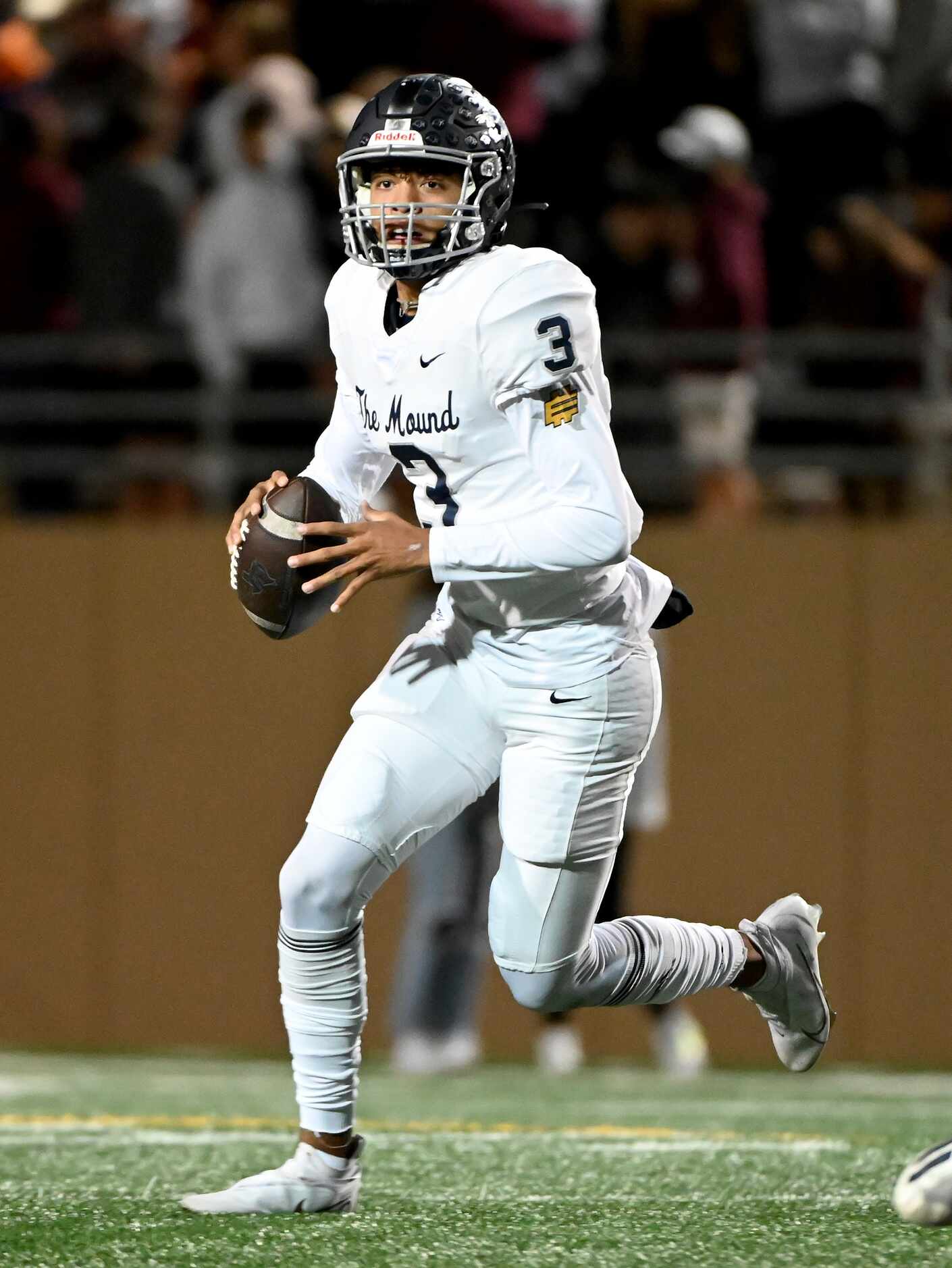 Flower Mound's quarterback Nick Evers (3) looks to pass in the first half of a high school...