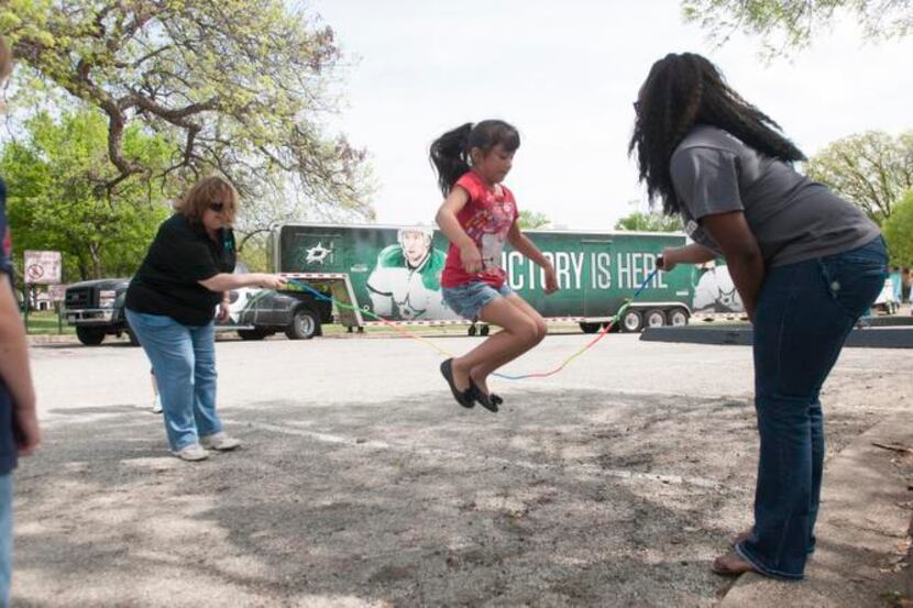 
Amy Garrido, 8, jumps rope during Molina Healthcare’s family fun event at Kidd Springs Park...