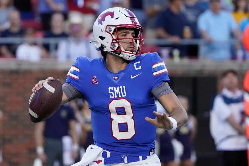 SMU quarterback Tanner Mordecai (8) looks to pass during the first half of an NCAA college...