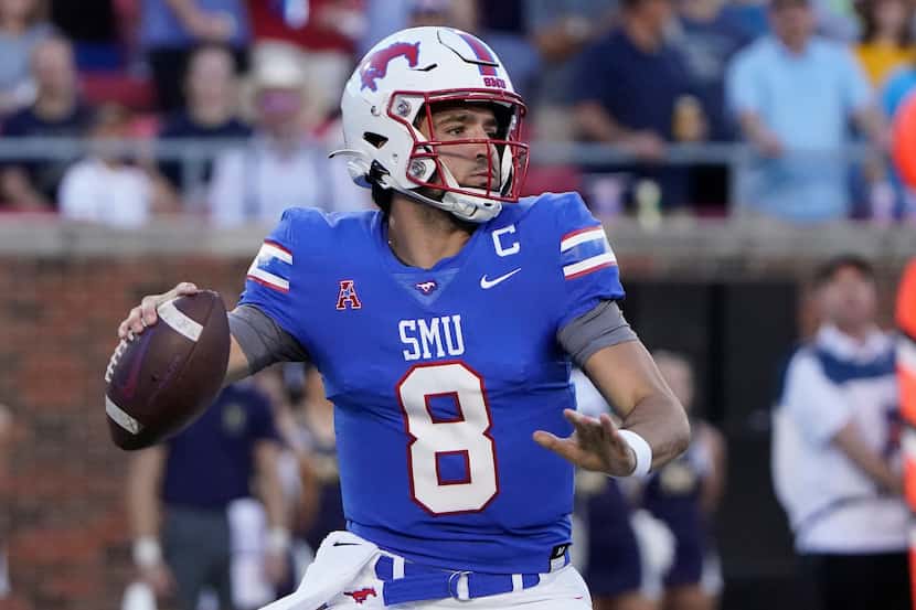 SMU quarterback Tanner Mordecai (8) looks to pass during the first half of an NCAA college...