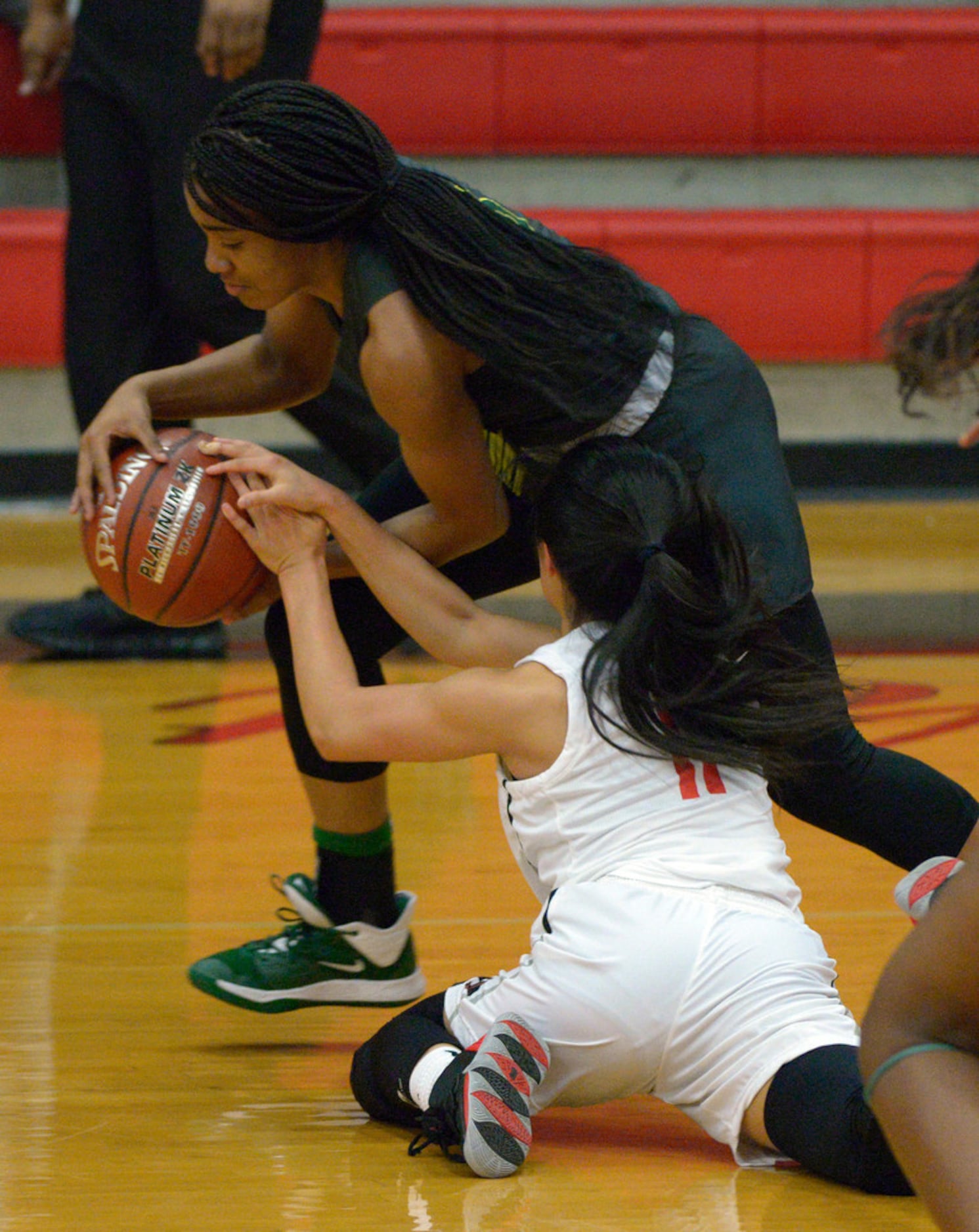 DeSoto's Kayla Glover steals the ball from Liberty's Kamen Wong (11) in the second half...