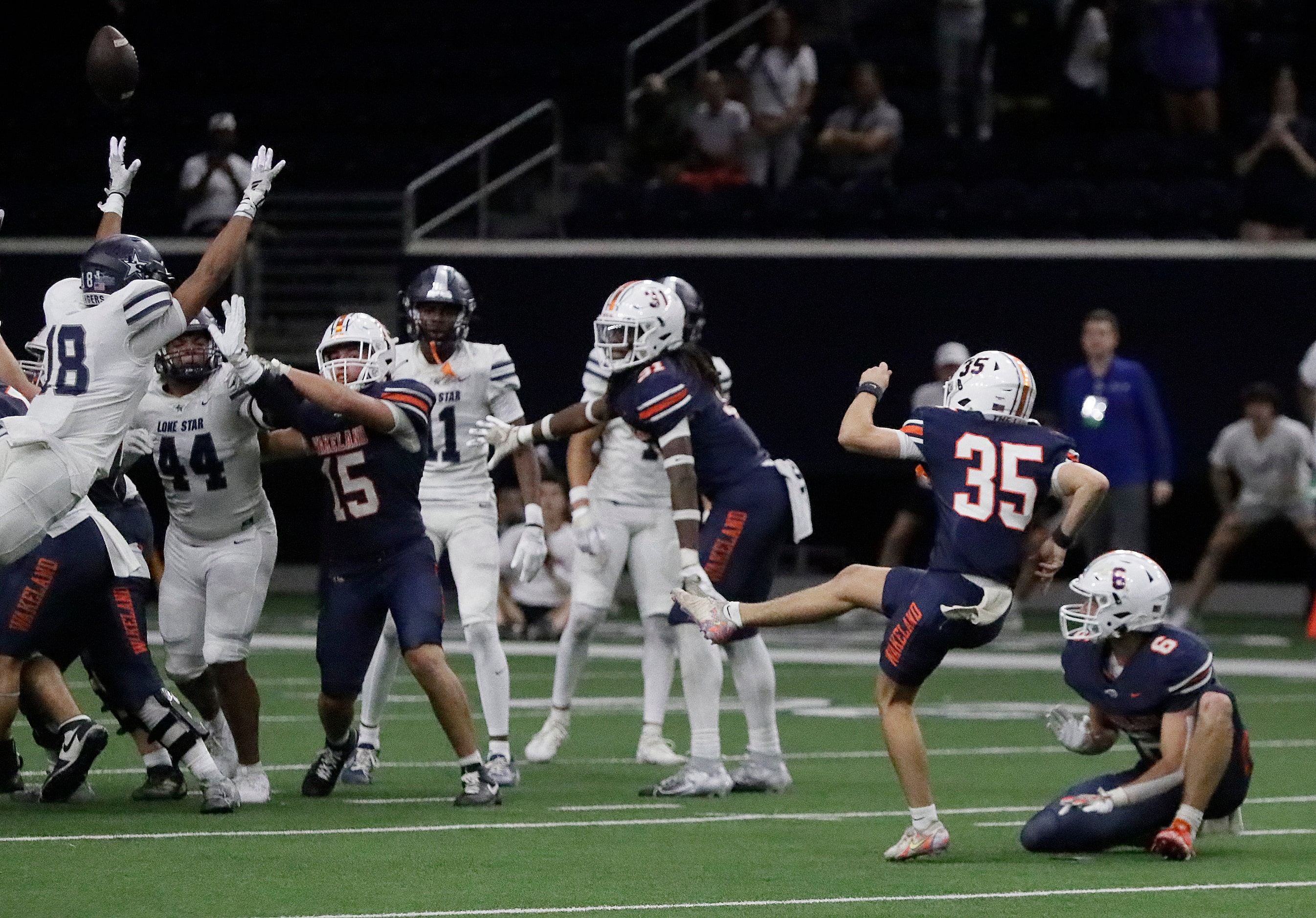 Wakeland High School kicker Jack Minsky (35) hits a 43 yard field goal as time expired to...