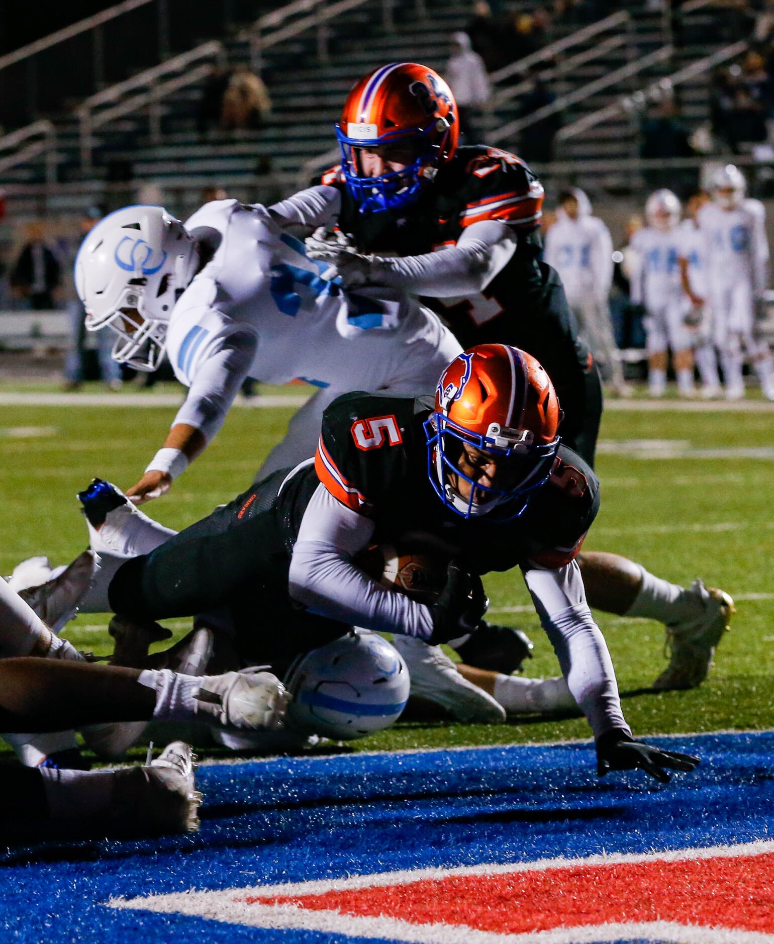 Colleyville Covenant's Jackson Owen (5) scores a touchdown against Cypress Christian during...