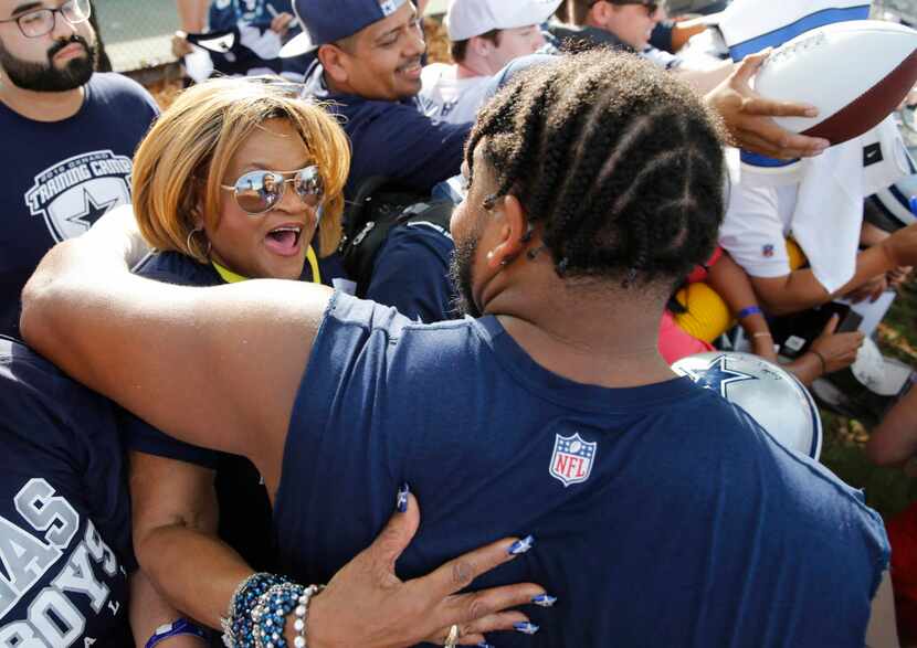 Carolyn Price gets a hug from Dallas Cowboys offensive guard La'el Collins (71) after the...