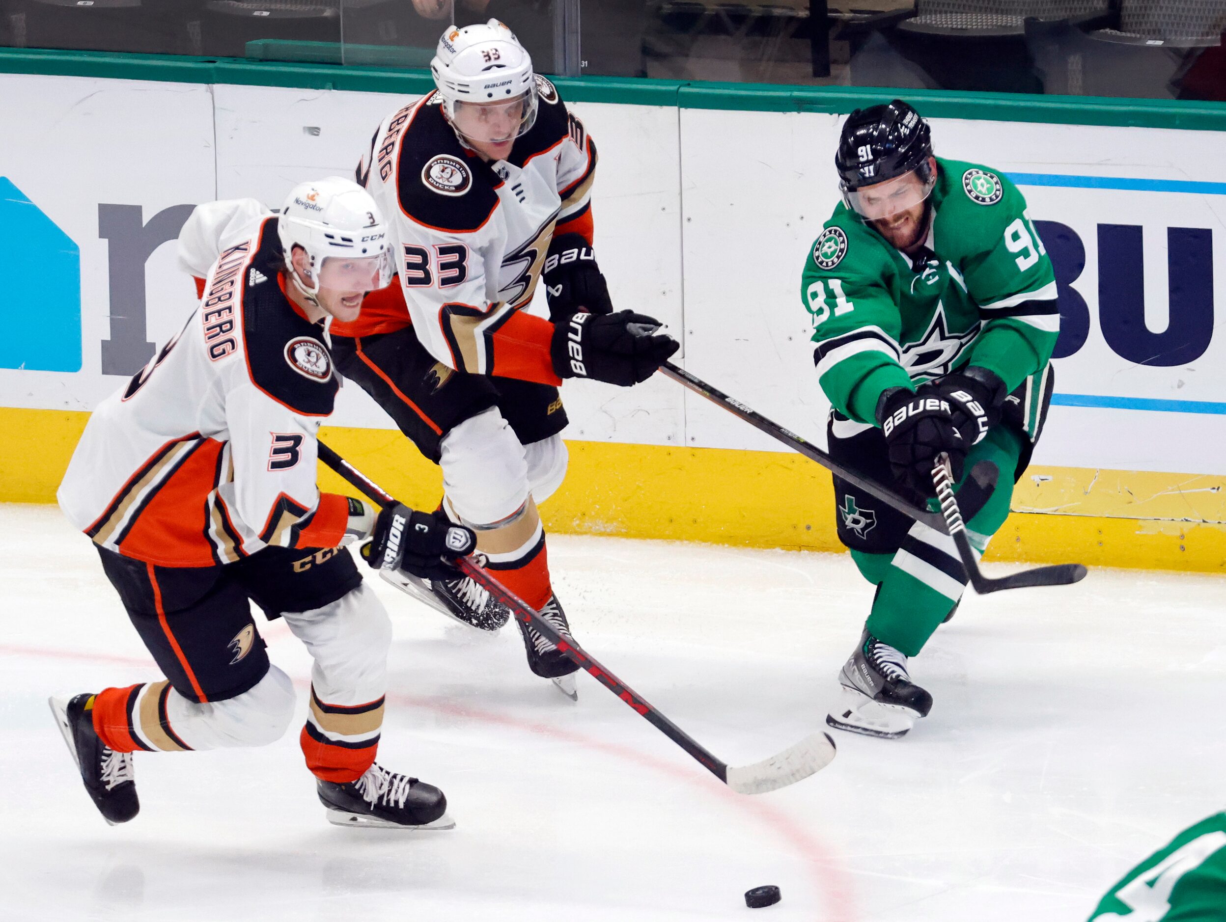 Dallas Stars center Tyler Seguin (91) passes the puck away from Anaheim Ducks defenseman...