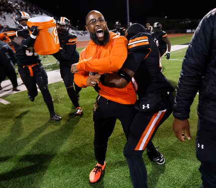 Lancaster head coach Leon Paul celebrates his first playoff win with a 35-15 defeat of...