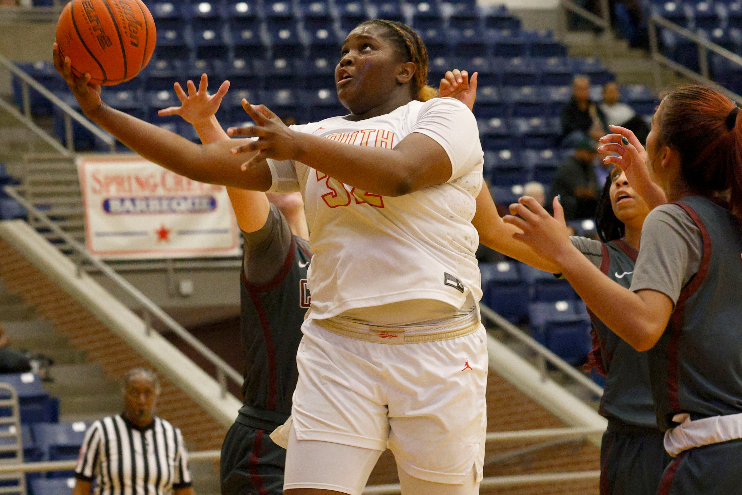 South Grand Prairie's Cedraiah Peterson (32) lays up a ball during the second half of a high...