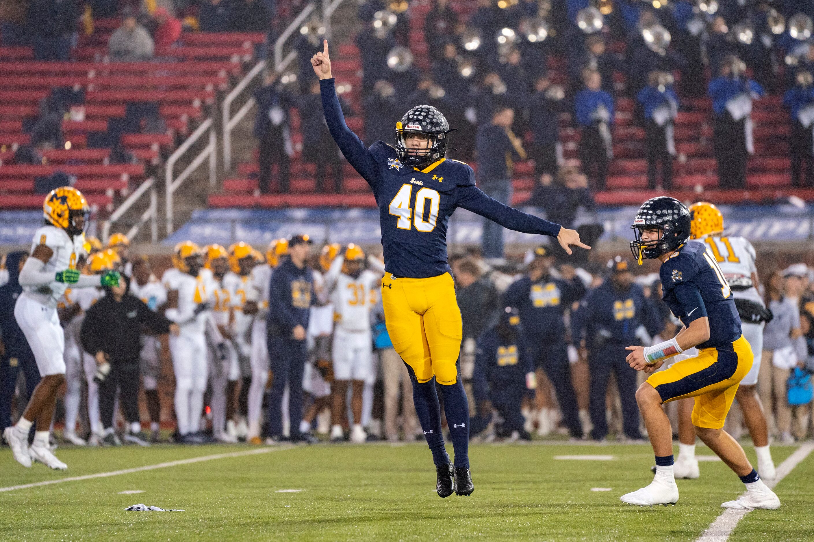 Highland Park senior kicker Nicholas Rigas (40) and holder Cade Trotter (10) celebrate...