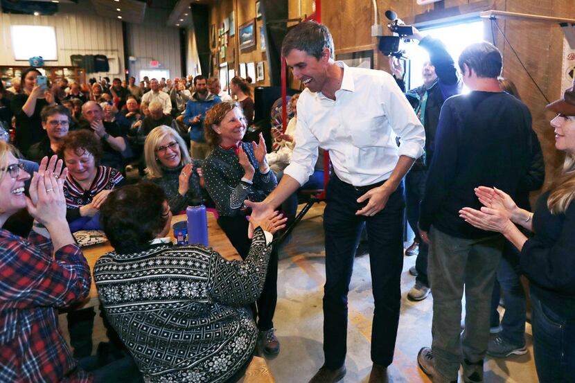 Former Texas Congressman Beto O'Rourke shakes hands during a campaign stop at a brewery in...