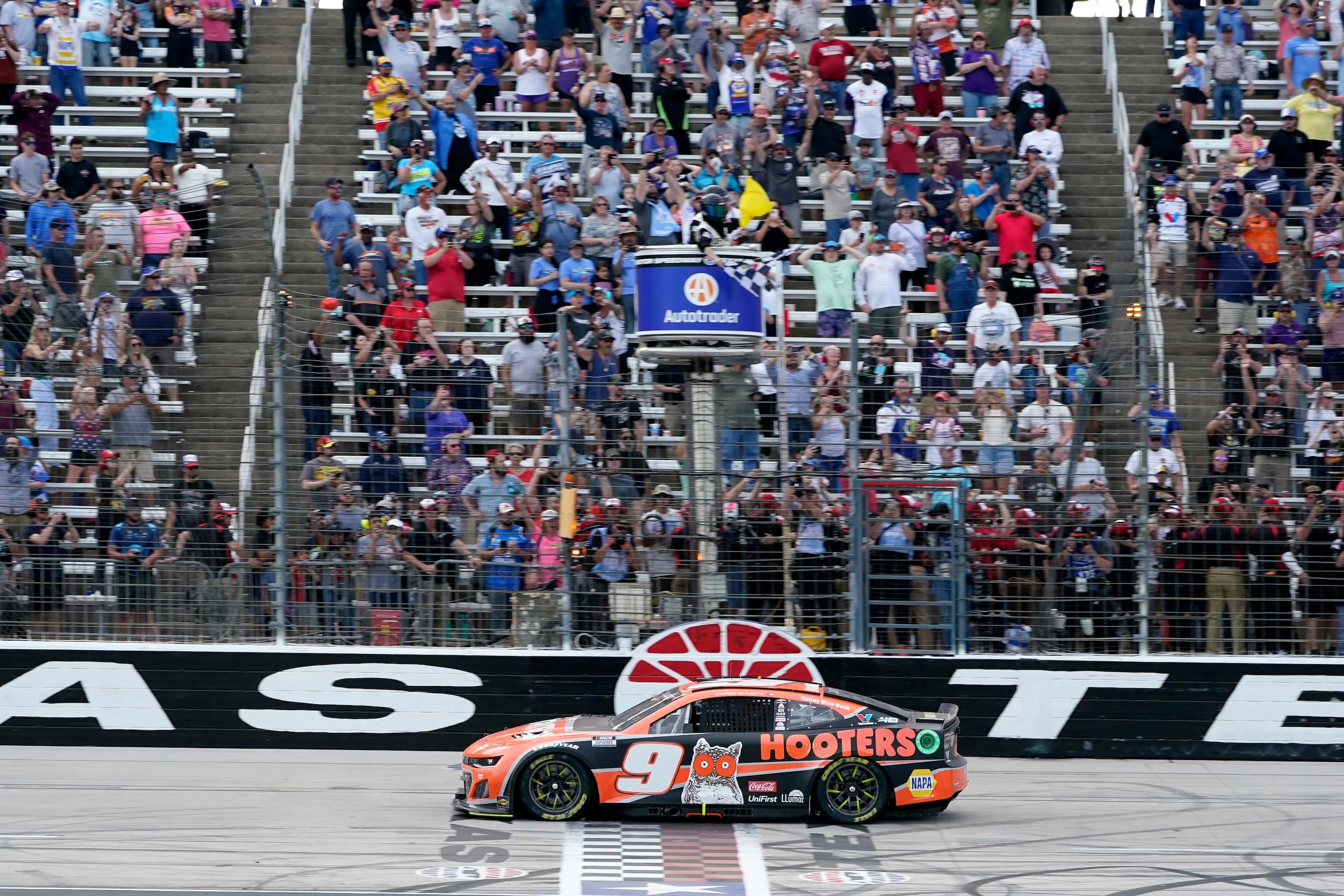 Chase Elliott crosses the finish line to win a NASCAR Cup Series auto race at Texas Motor...