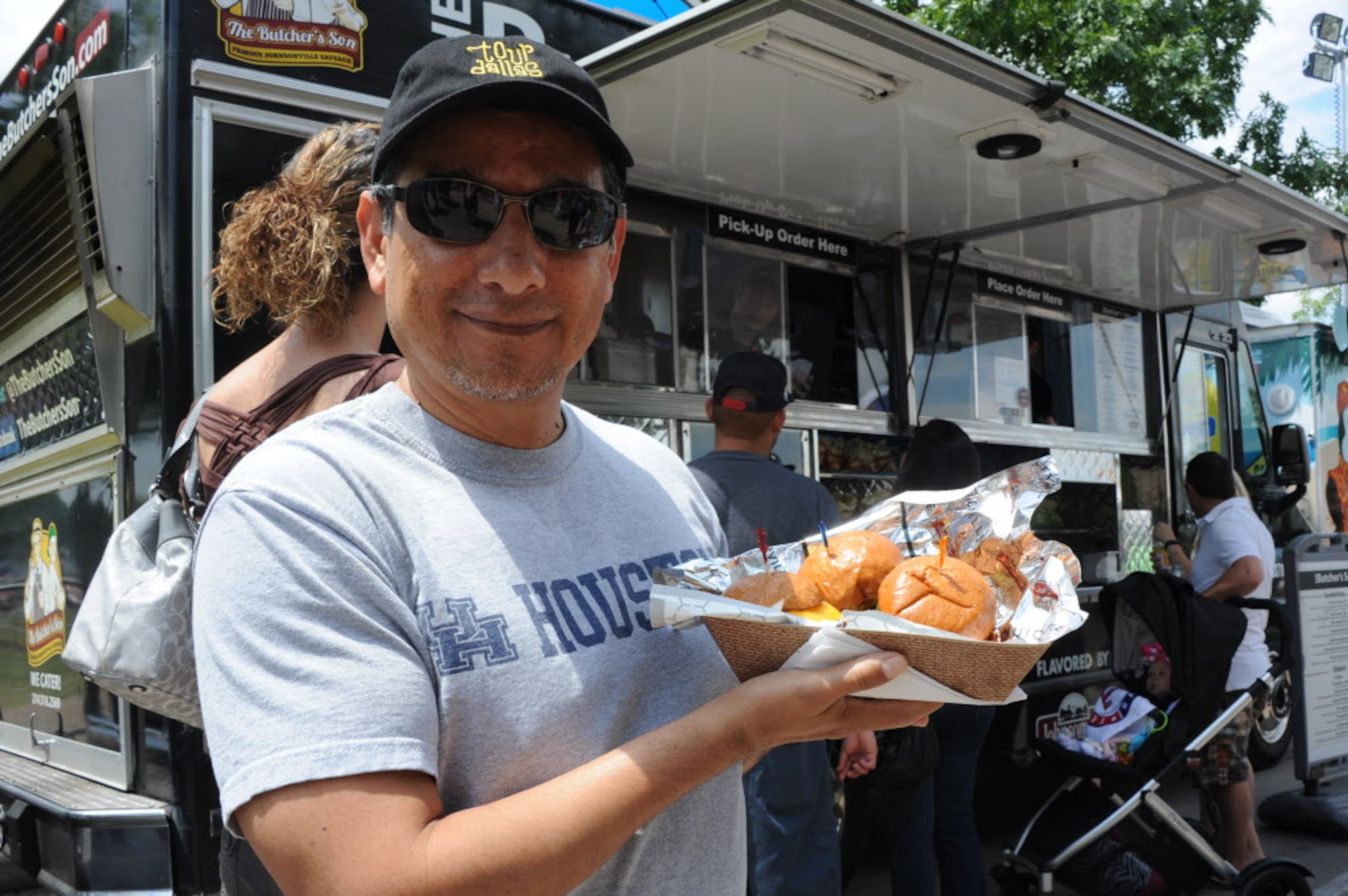 Robert Balleza orders sliders from The Butcher's Son food truck at the Food Truck Festival...