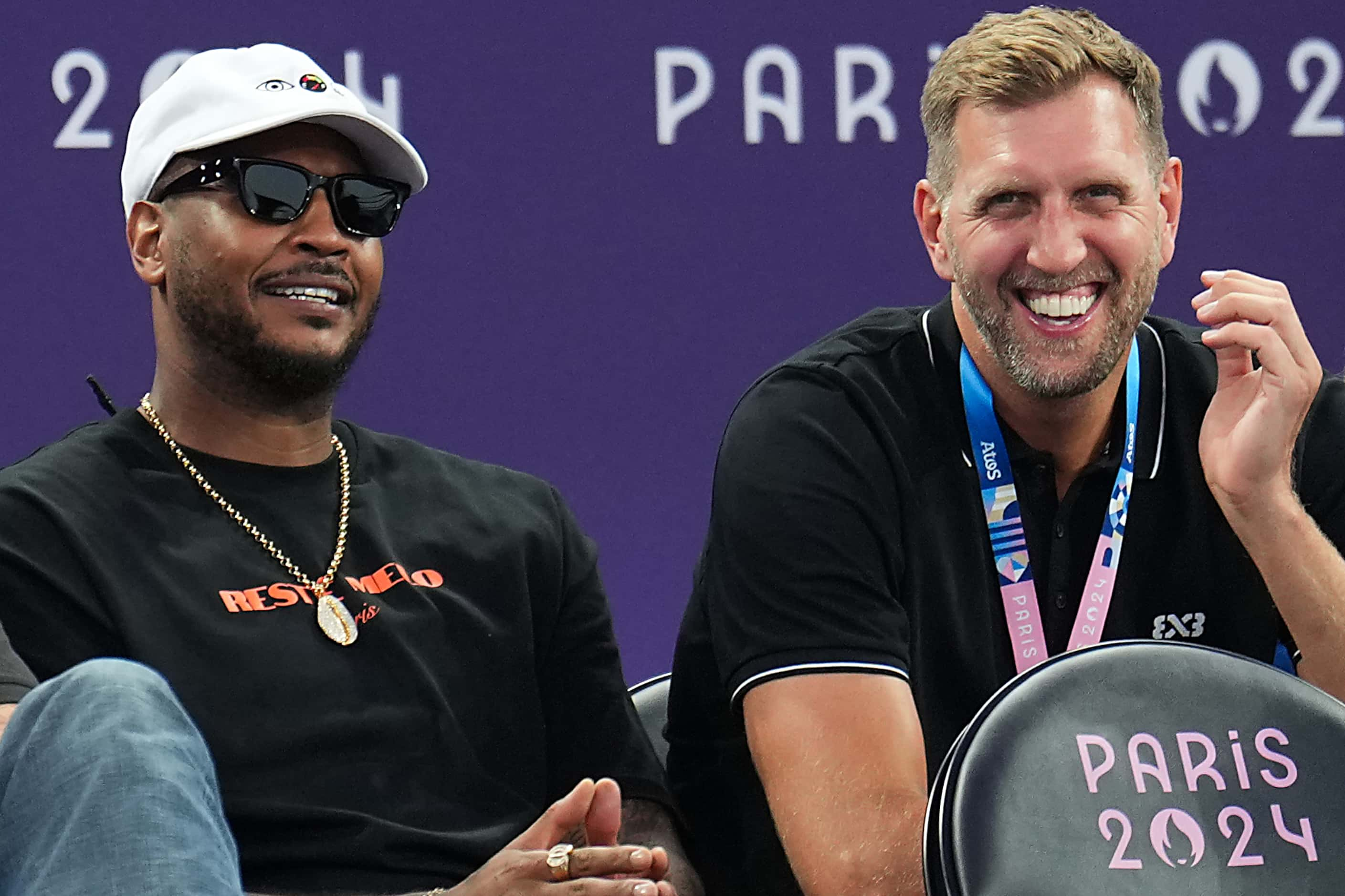 Dallas Mavericks great Dirk Nowitzki (right) watches during the women’s 3x3 basketball...