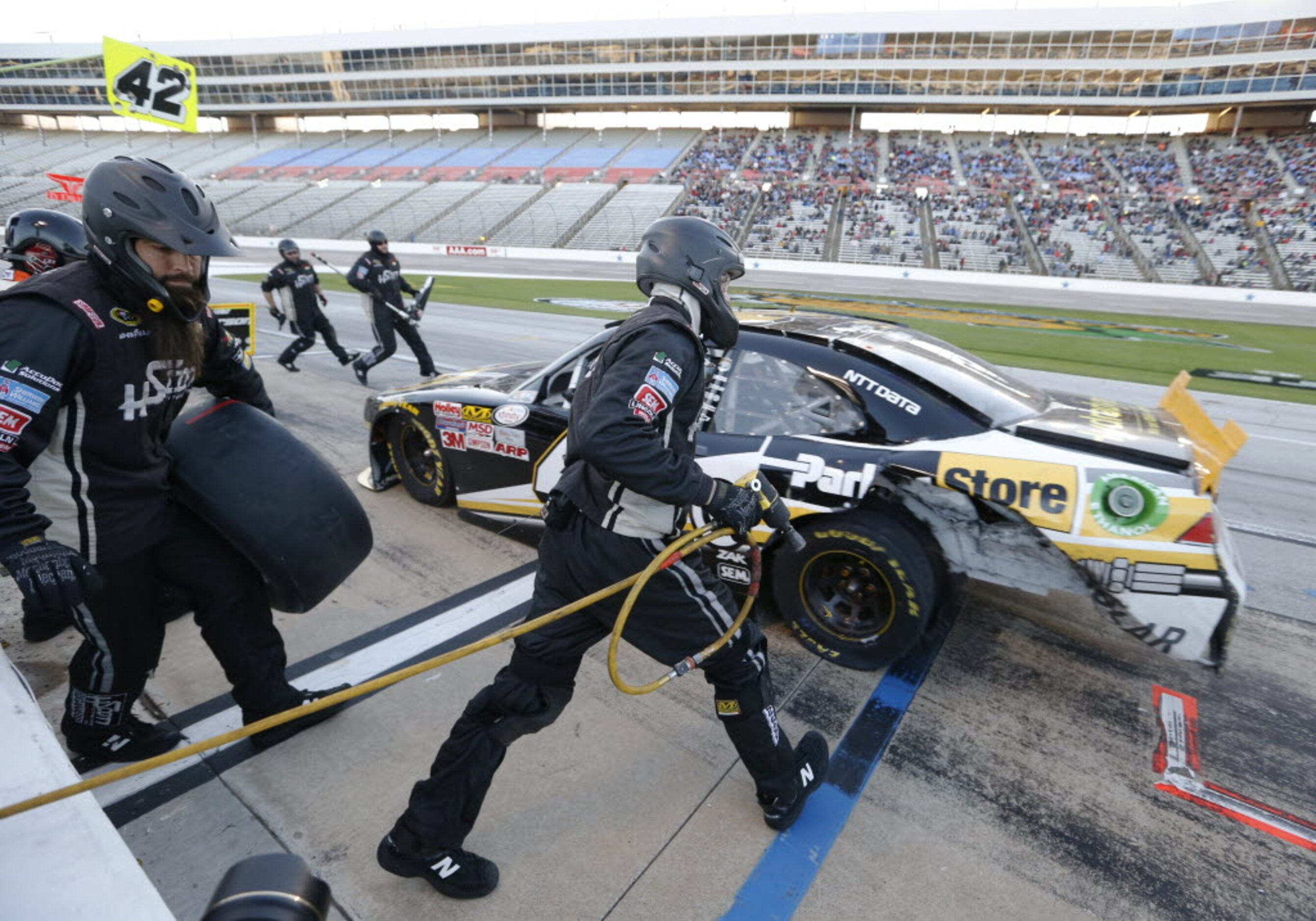 Pit crew works on Kyle Larson (42) car during a pit stop during the NASCAR XFINITY SERIES...