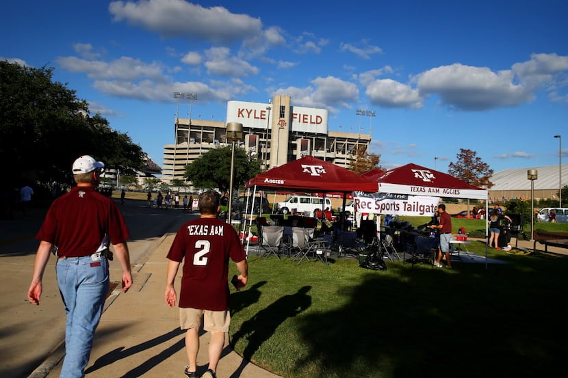 Texas AM Aggies fans walk towards Kyle Field prior to the game against the SMU Mustangs....