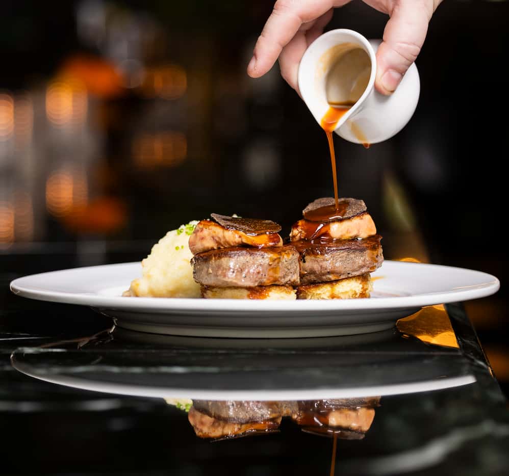 The Tournedos Rossini are filets with foie gras on brioche, with black truffle and whipped...