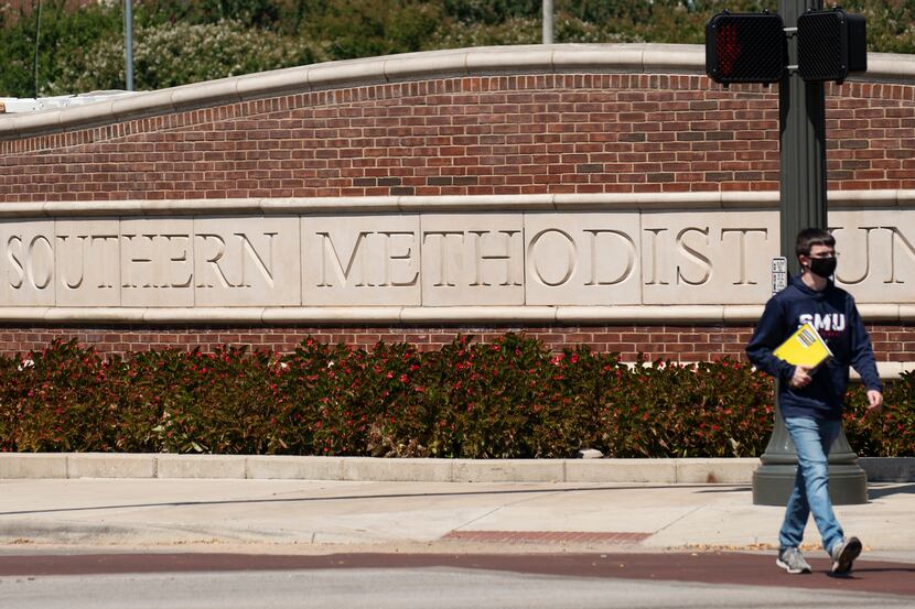 A student walks in front of the main entrance sign outside of the campus of Southern...