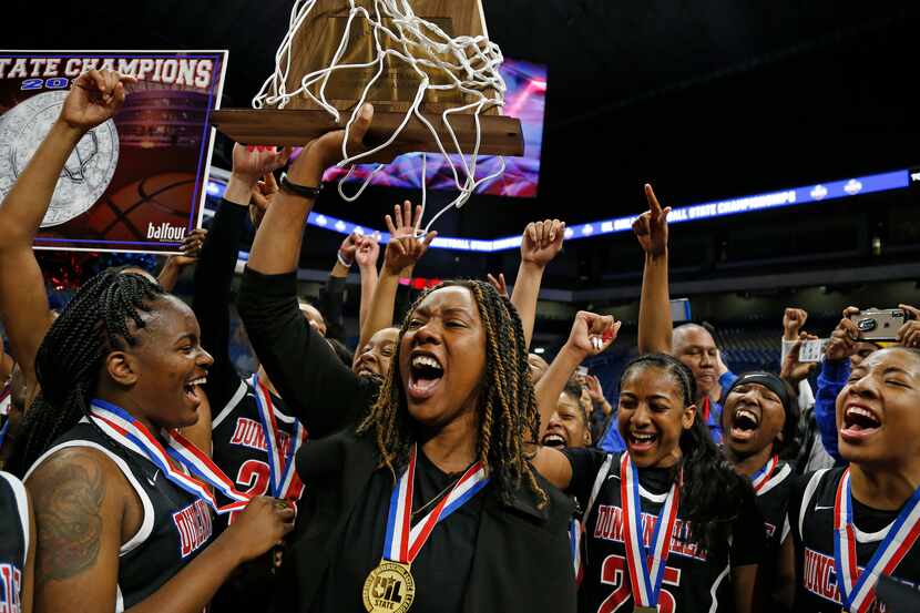 Duncanville head coach LaJeanna Howard holds the Trophy in a 6A final on  Saturday, March 7,...