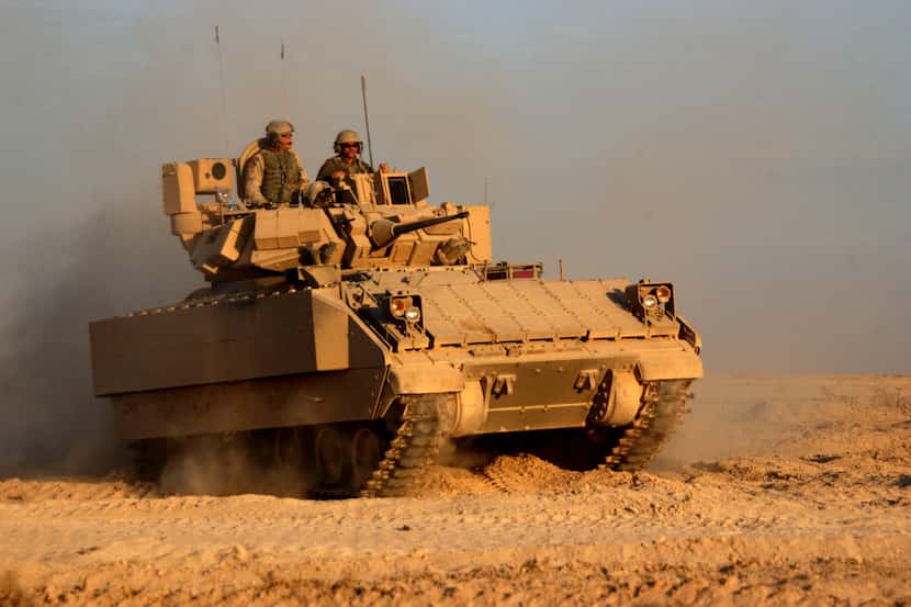 A Bradley Fighting Vehicle rolled back out to the fight after refueling during a combat...