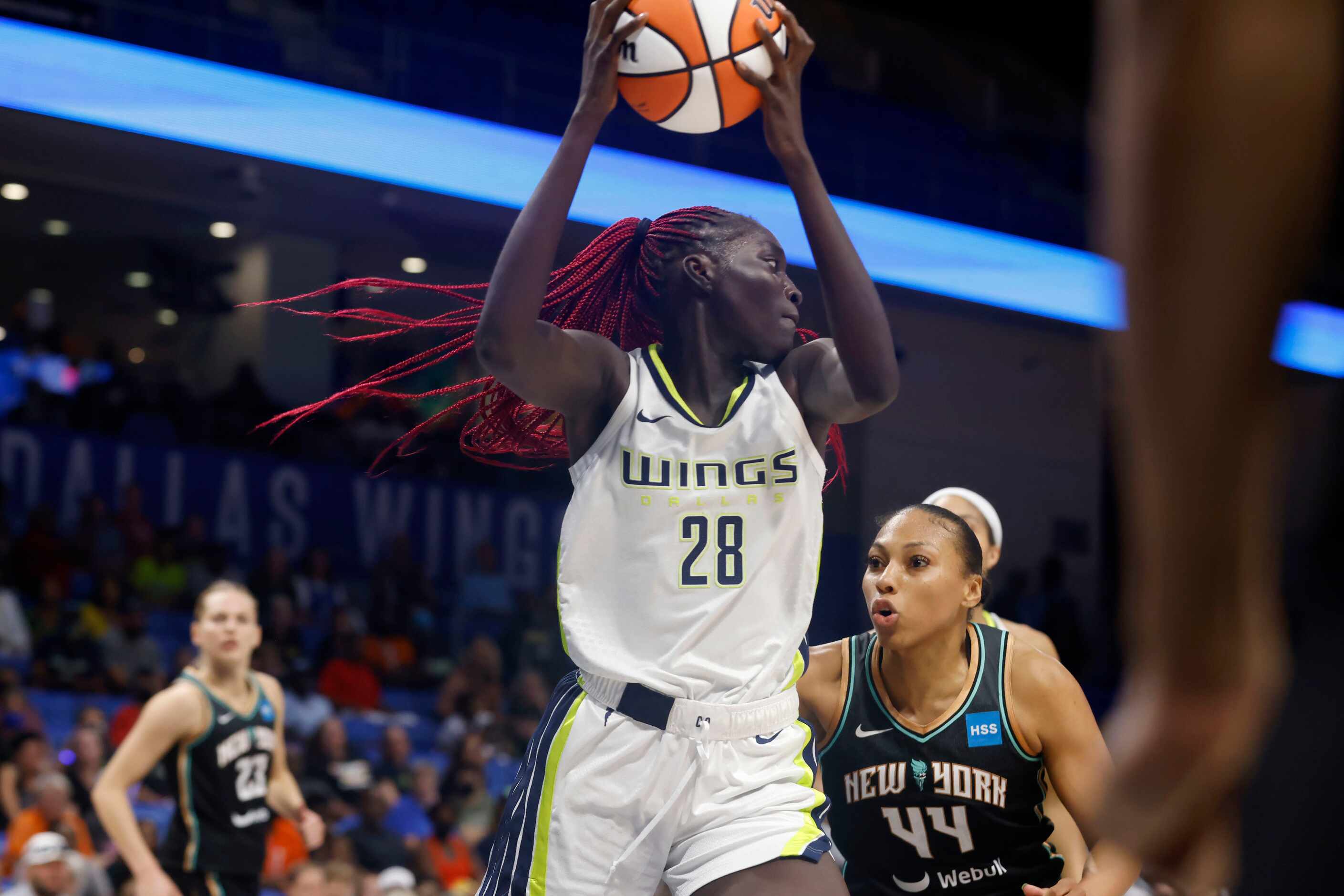 Dallas Wings center Awak Kuier (28) grabs a rebound in front of New York Liberty forward...