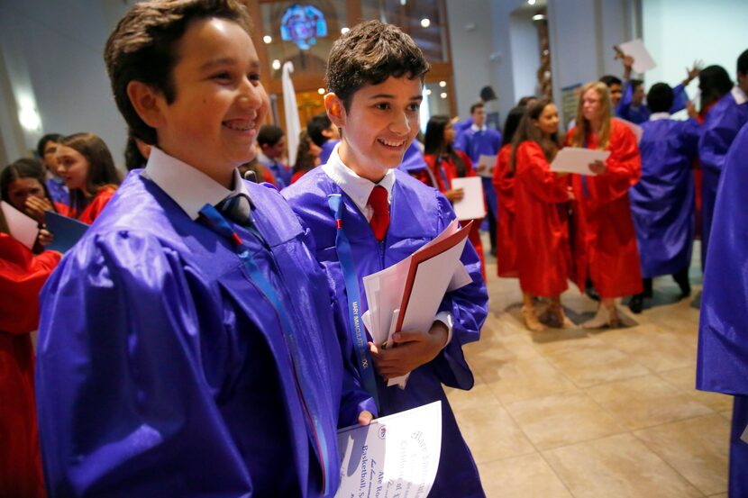 Zach (center) was all smiles as he and his classmates wrapped up their graduation last month...