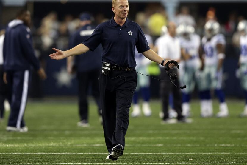 Dallas Cowboys head coach Jason Garrett questions a no call in a game against the Green Bay...