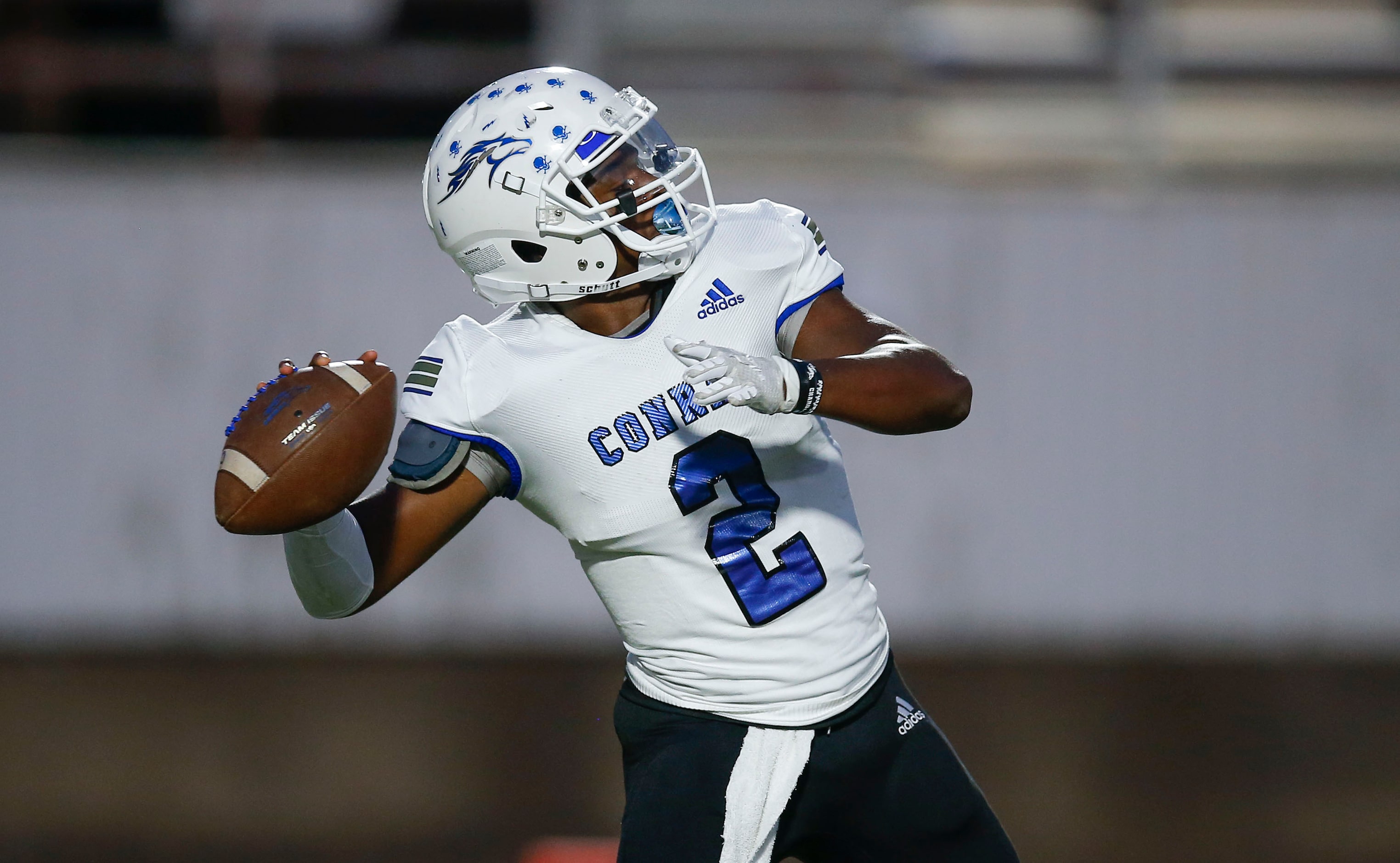 Conrad junior quarterback Chris Legard throws during the first half of a high school...